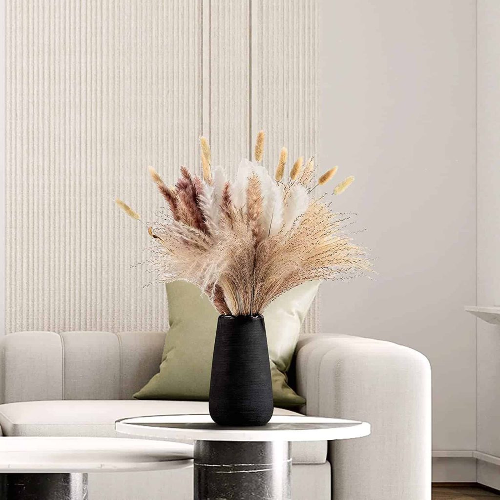 Using a modern looking pot for a boho designed room to incorporate plants in a home