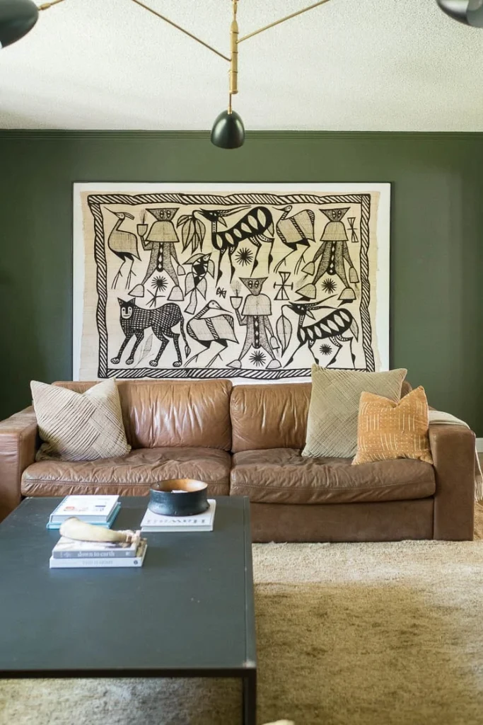 Nothing says modern like modern art hung on a wall in a living room with some soft leather couch tones