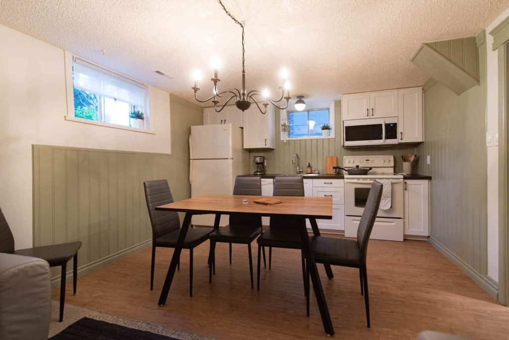 behr dusty olive paint color in kitchen with beadboard walls