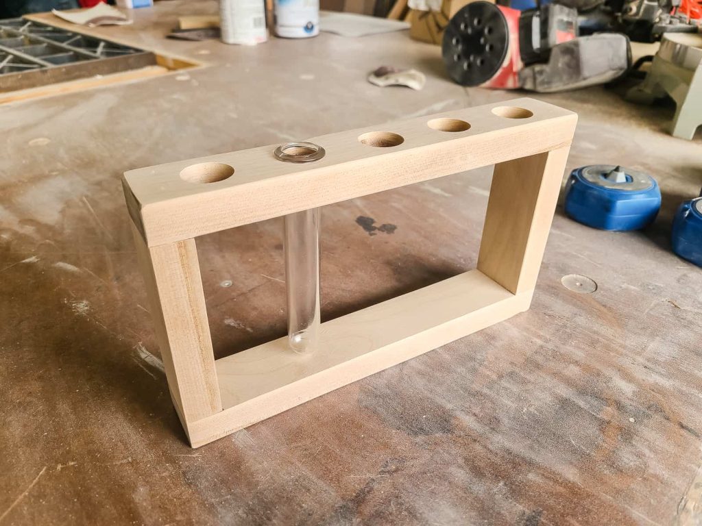 an assembled diy propagation station with a tube in that is ready to be finished with stain