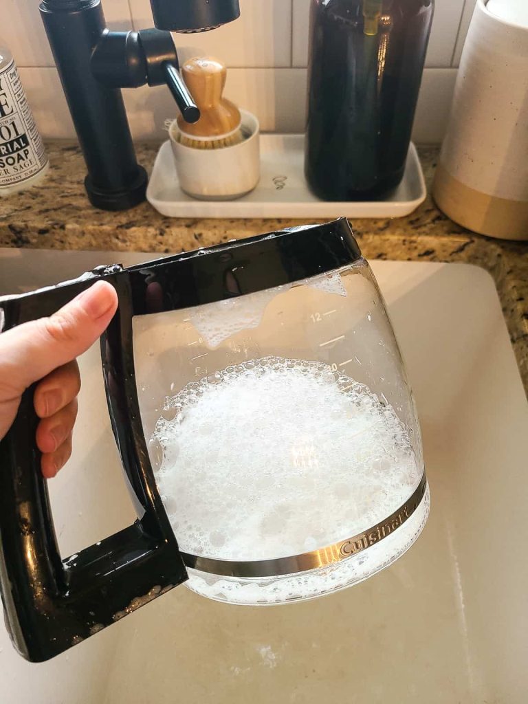 https://www.makingmanzanita.com/wp-content/uploads/2023/04/cleaning-coffee-carafe-with-water-768x1024.jpg