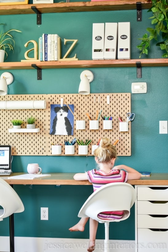 bright green on the wall behind desks in this homeschool room