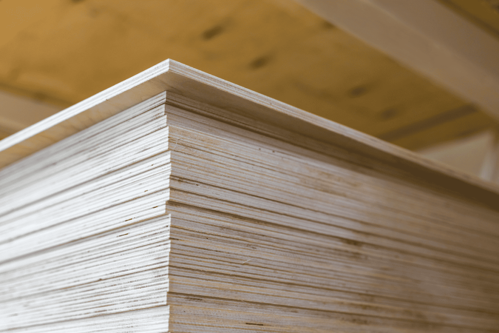 Stack of birch plywood in the aisle of a home depot that the staff will cut down for customers