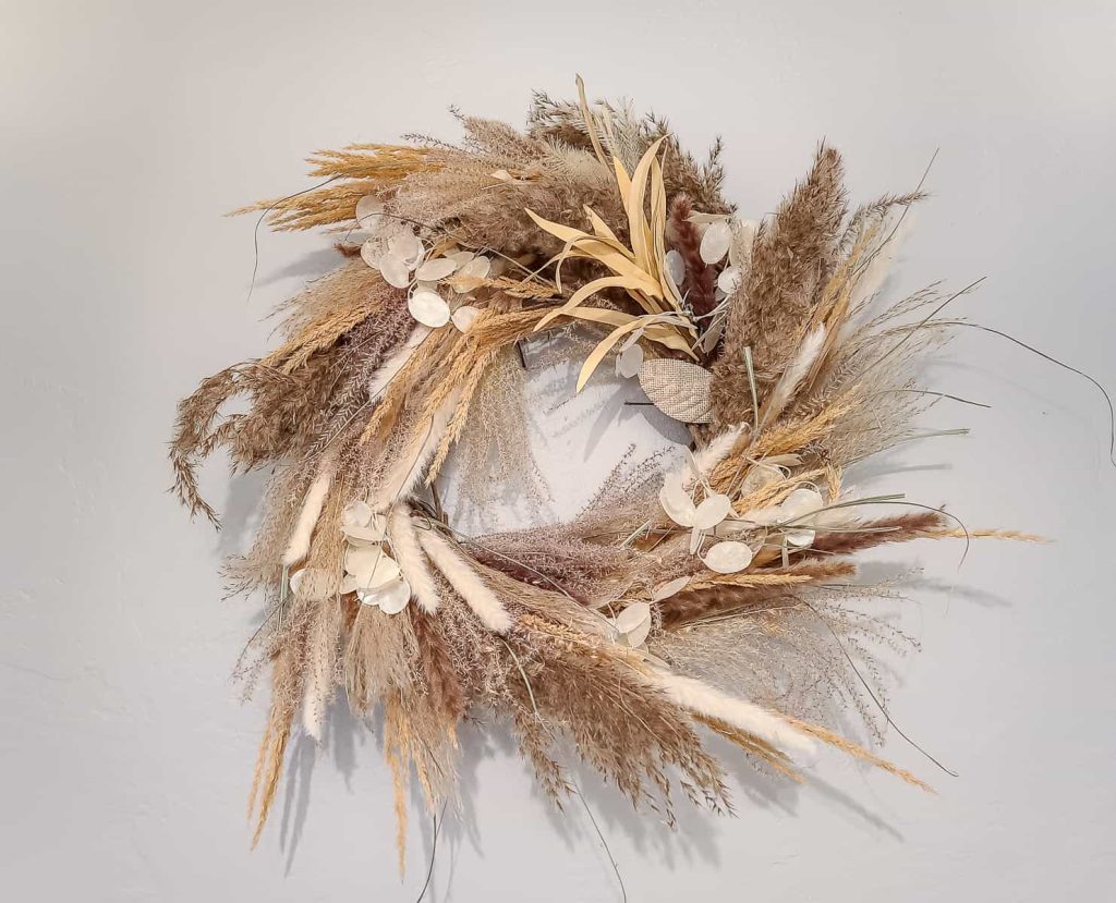 Make this DIY Mixed Pampas Grass Wreath to hang on your wall.