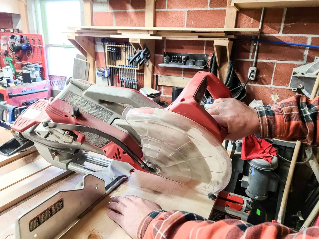 12-in dual bevel sliding compound miter saw in action, smoothly cutting through the wood