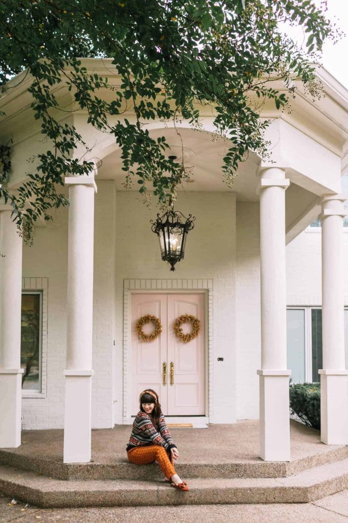 large portico with pink painted door