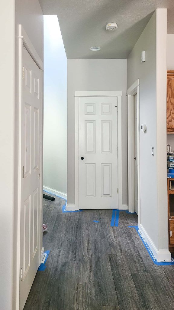 Baseboards in home painted with off white Swiss Coffee paint color