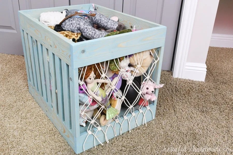 DIY wooden stuffed animal storage using common boards and macrame string