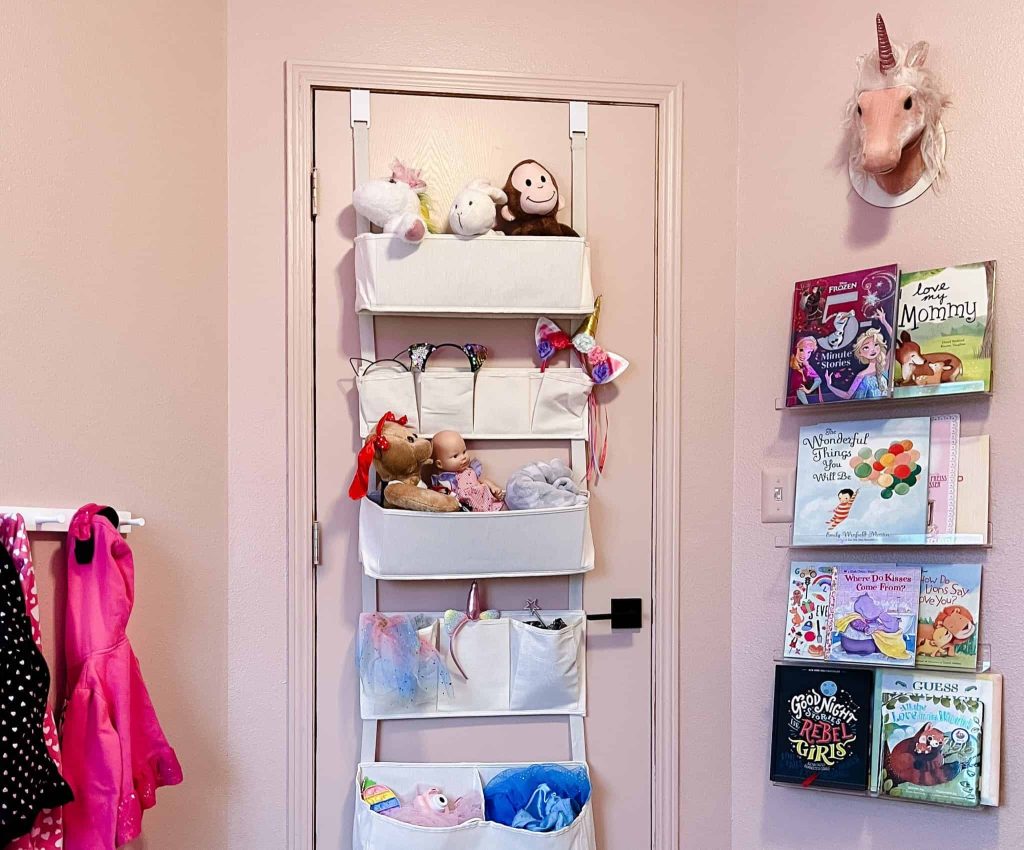 stuffed animal storage in an over the door organizer