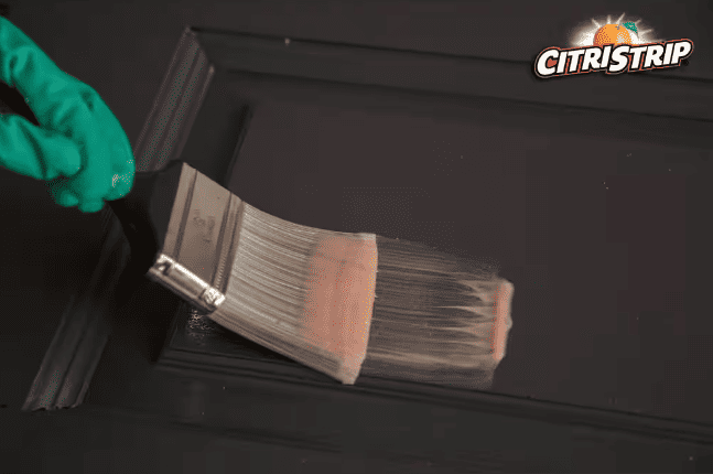 A paint brush with a pink gel CitriStrip to remove paint