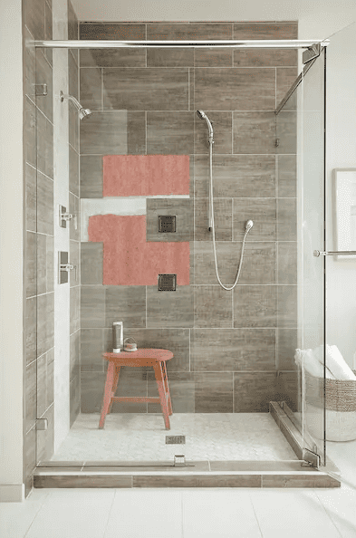 photo of a shower room with a stool and a shower showing the backer board behind the tile displayed