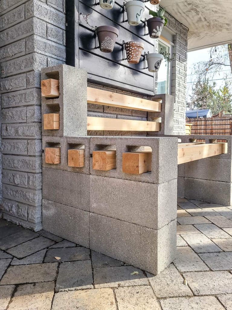 The photo shows to set of wood into cinder blocks.