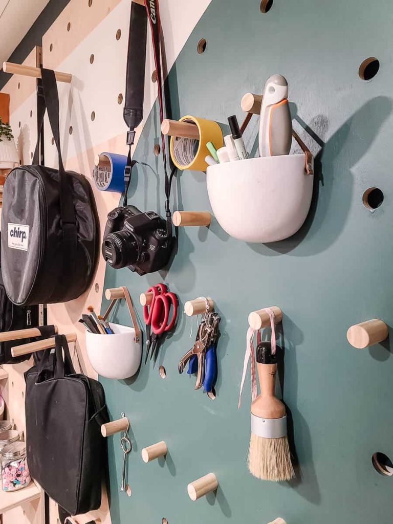 A picture of a pegboard with different items that can be hung on it.