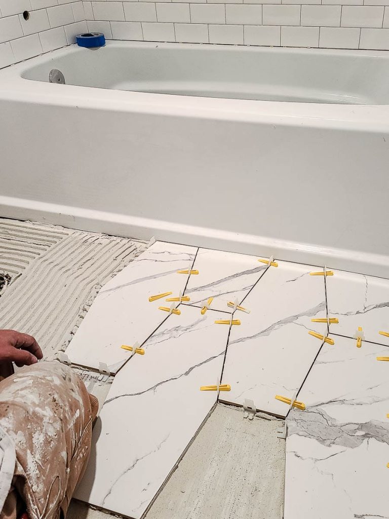 Bathroom tile floor being installed