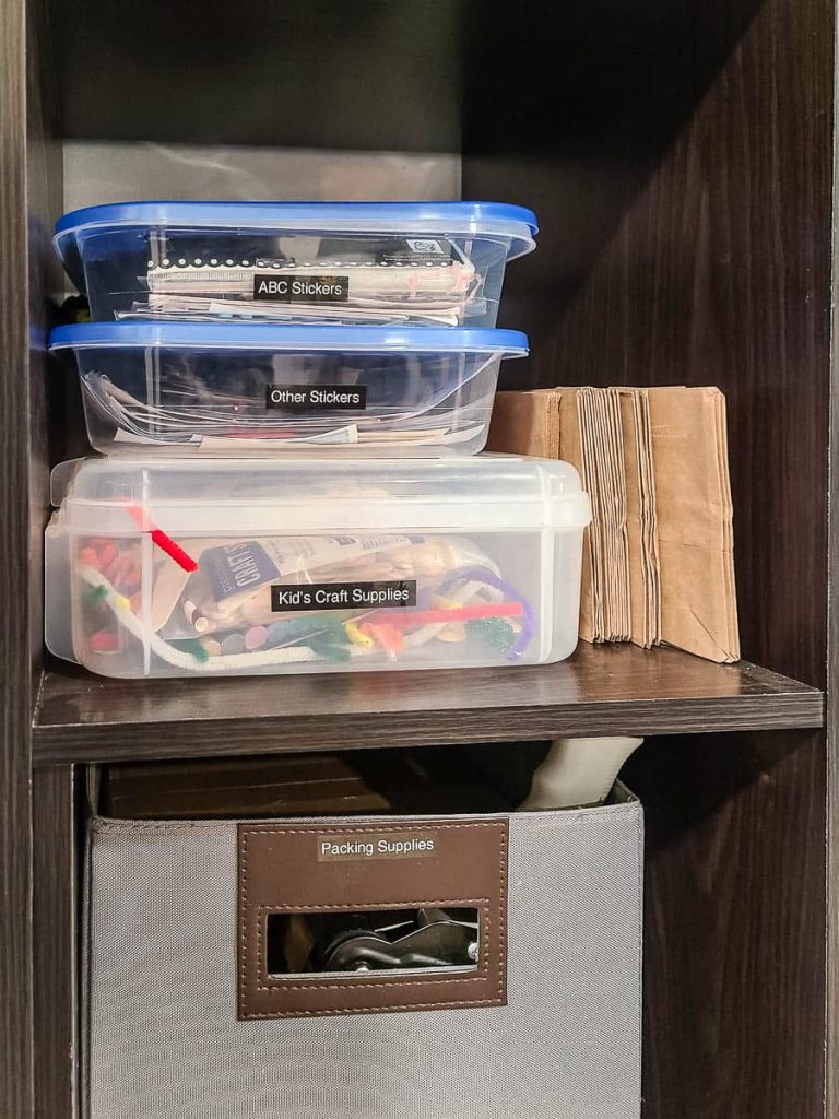 Closet with art supplies with labeled organizers