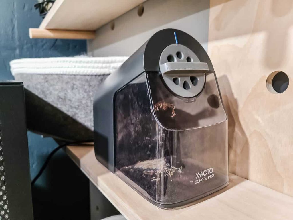 An image of a pencil sharpener from one of the wood shelves in the homeschool room