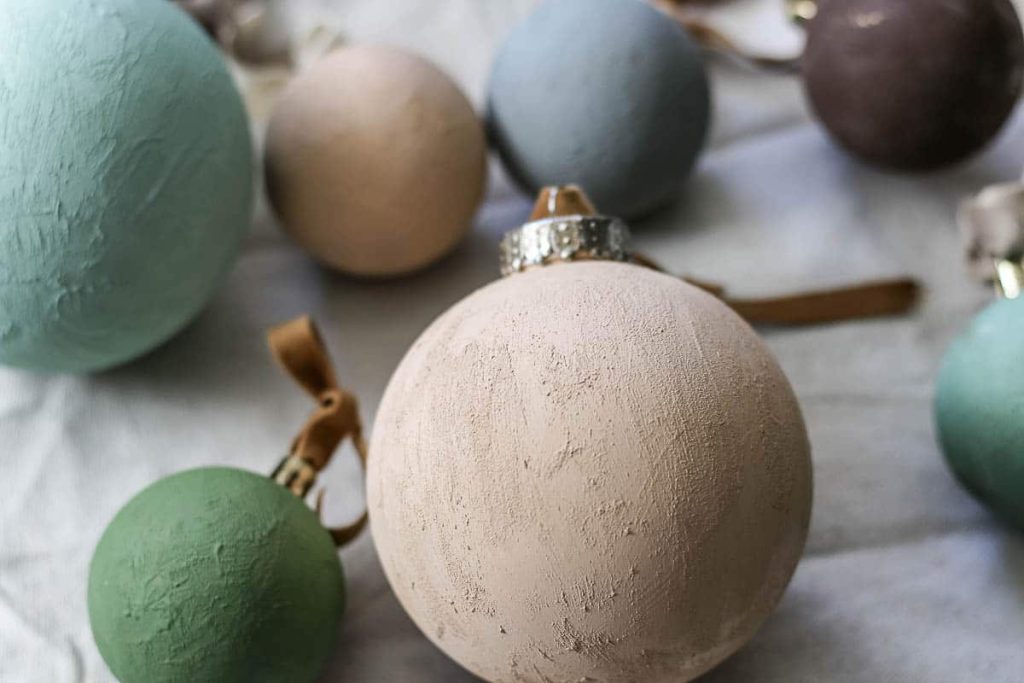 This is another picture of textured ornaments with ribbon on top.