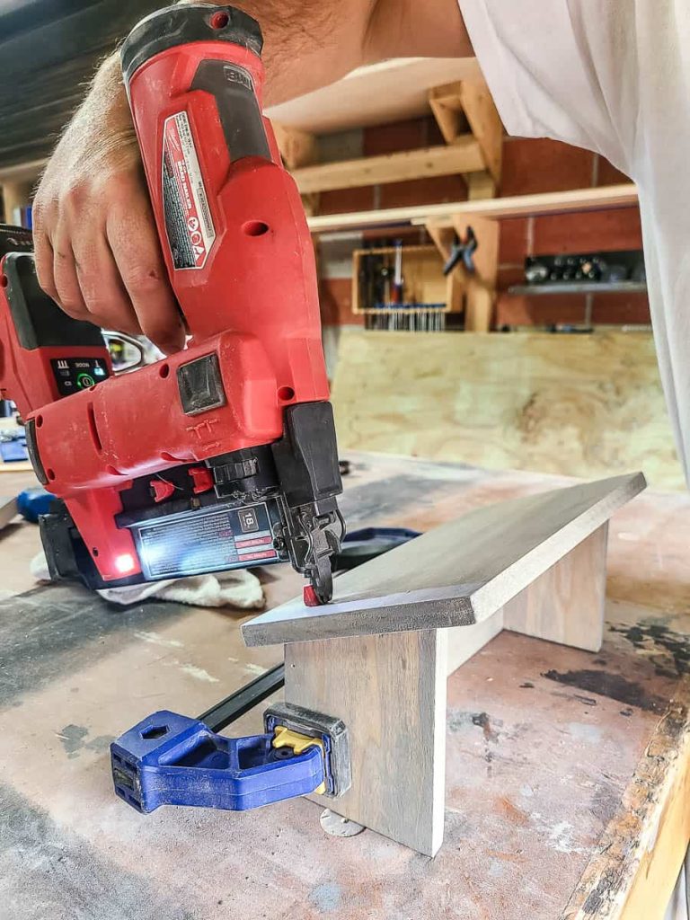 Clamp the side of a wood to keep it in place using a bar clamp.