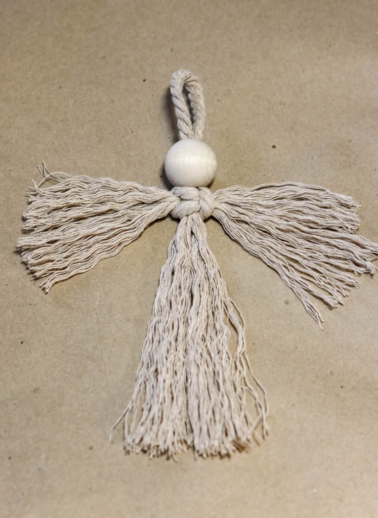 After being unraveled by a comb, an angel-style Christmas ornament looks like this.