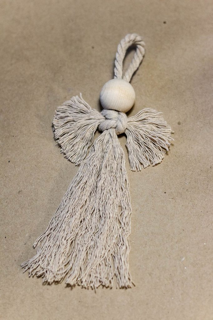 After being unraveled and cut with scissors, an angel-style Christmas ornament looks like this.