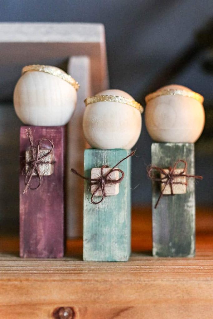 3 wooden dolls