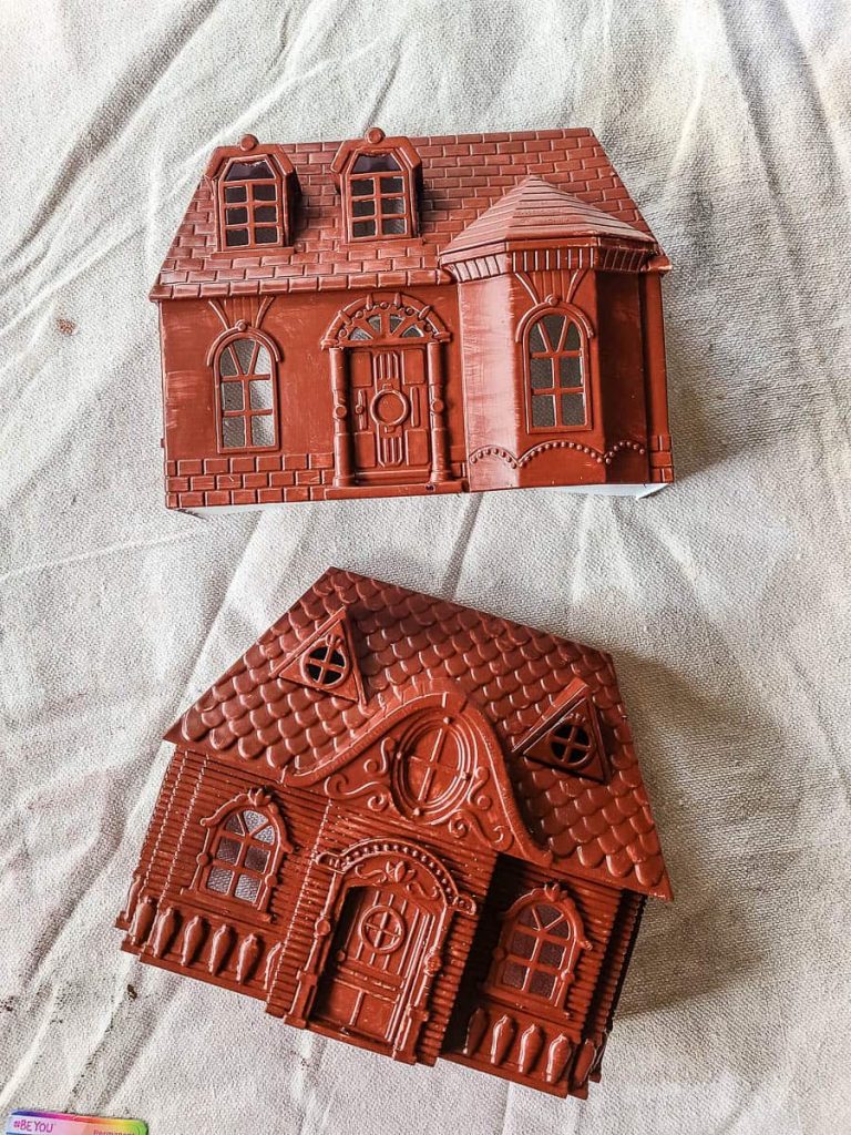 Dollhouse painted with brown acrylic, received 4-5 coats for a rich and inviting finish.