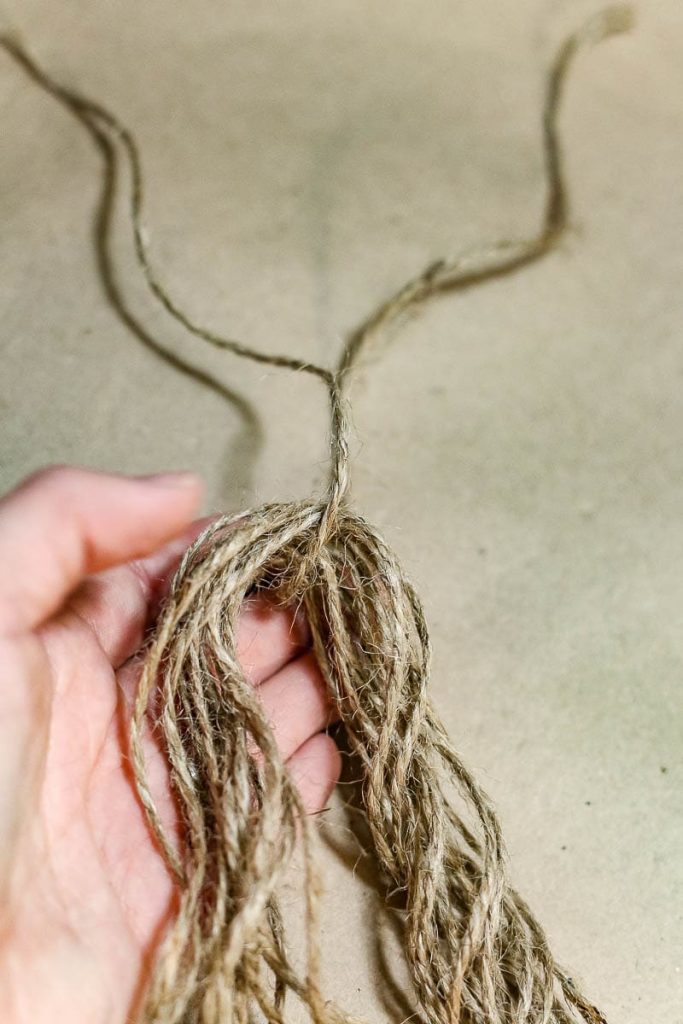 A person holding a twine