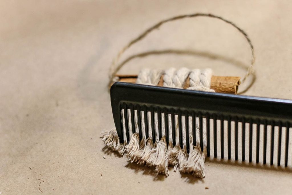 Comb with the attached macrame cord.