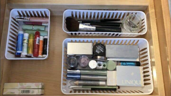 An image featuring acrylic bins used as organizers within a drawer, presenting a clear and efficient storage solution for neatly arranging and categorizing items.