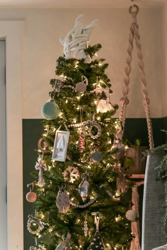 Get up close with a Boho Christmas tree, adorned with an array of eclectic ornaments, macramé touches, and sparkling lights, creating a uniquely charming and festive holiday ambiance.