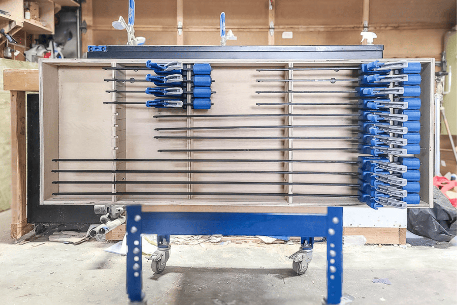 A photo of DIY clamp rack came together with just one piece of plywood 