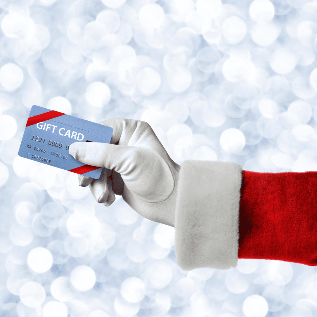 An image of gift card holding by Santa Claus.