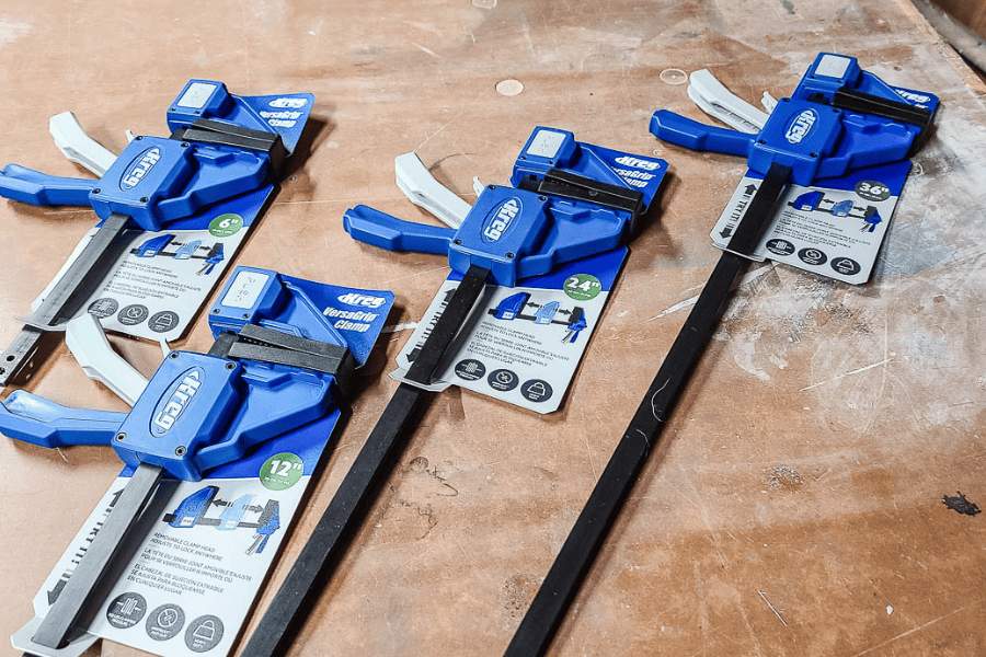 Four images of Kreg VersaGrip Clamps on the ground.
