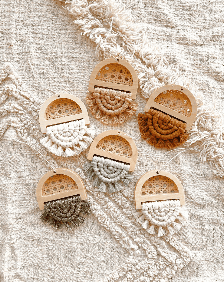 A close-up view of a boho-styled Christmas tree ornament featuring mini cane accents, adding a touch of natural and eclectic charm to the festive holiday decor.