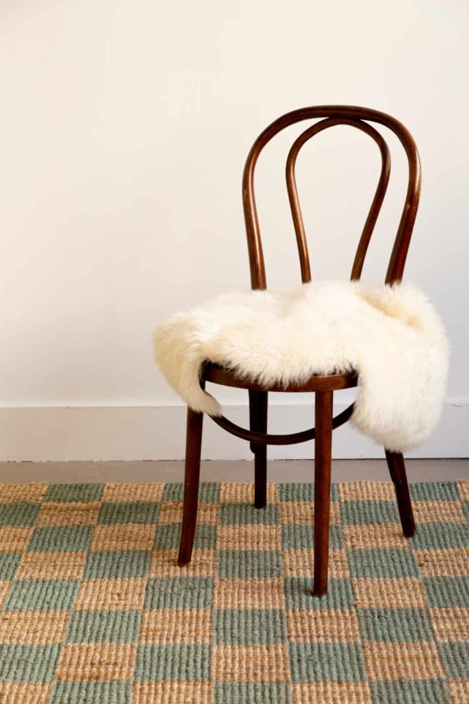 A DIY checkered jute rug with a chair