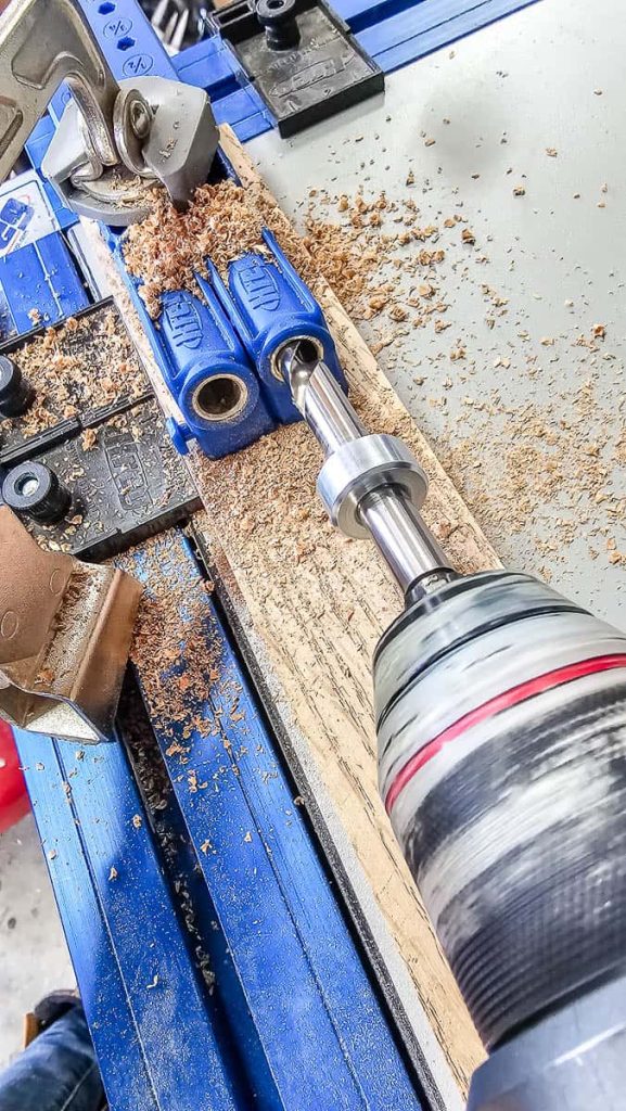 Image capturing drilling of pocket holes with the Kreg Pocket Hole Jig 320, featuring the jig clamp securely in place.
