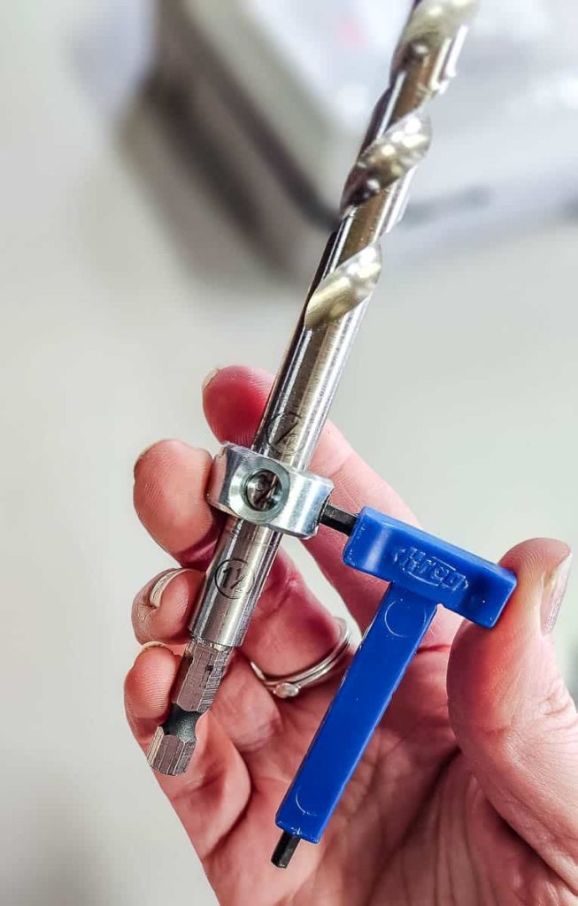 Photo demonstrating the setting of the stop collar on the drill bit.