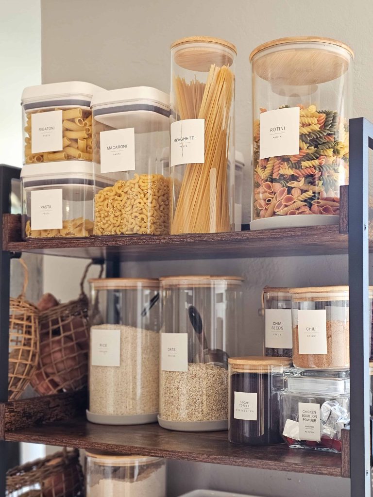 Here's a picture of a shelf featuring food storage containers holding rice and oats, alongside small containers.