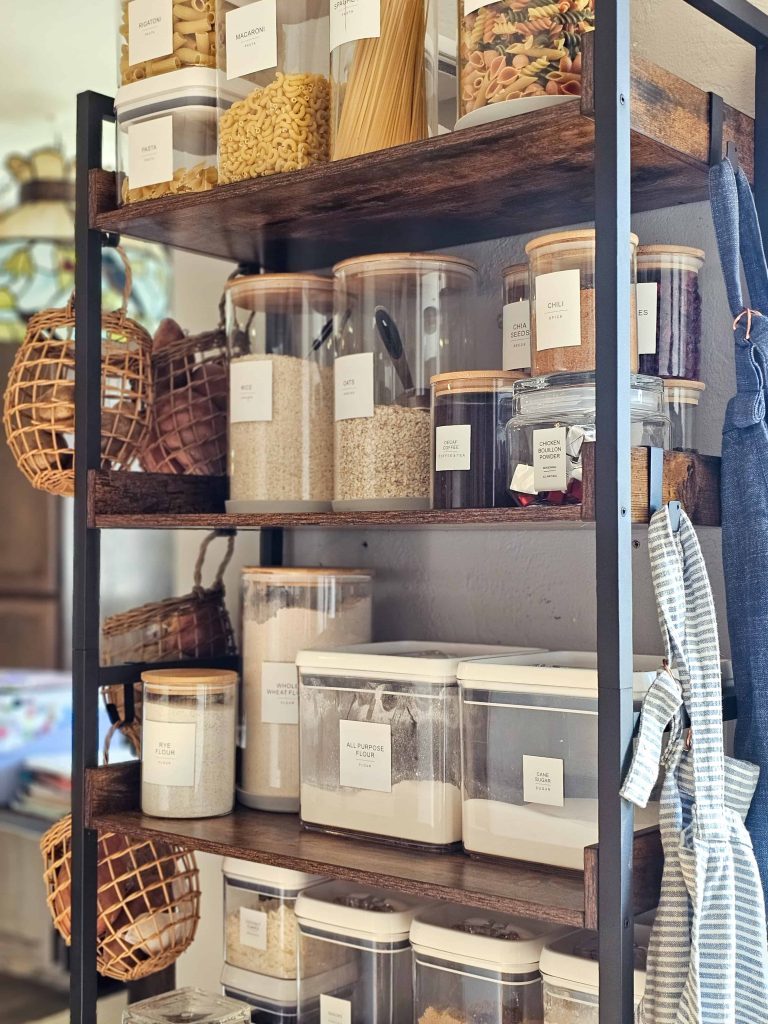 A photo of a shelf with food storage containers and baking supplies.