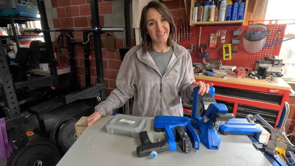 A woman is pictured with three Kreg jigs in the photo.