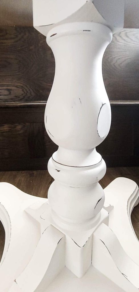 The table base has been coated with a layer of white paint, adding a clean and polished finish to the overall appearance.