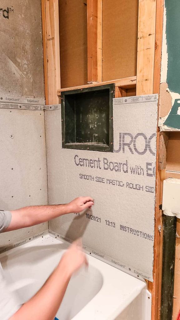The cement board is installed on the wall of a bathroom.