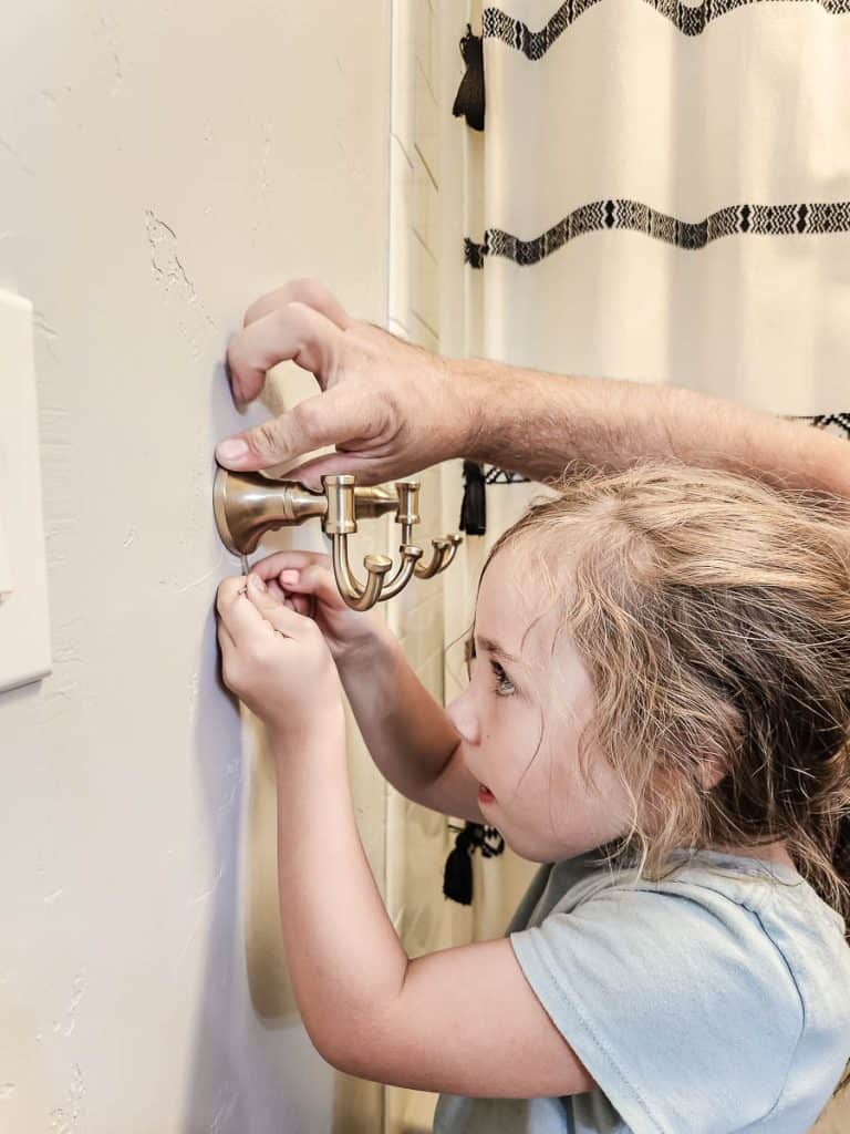 Installing new bathroom accessories in Champagne Bronze is so easy, even the kids can help out!