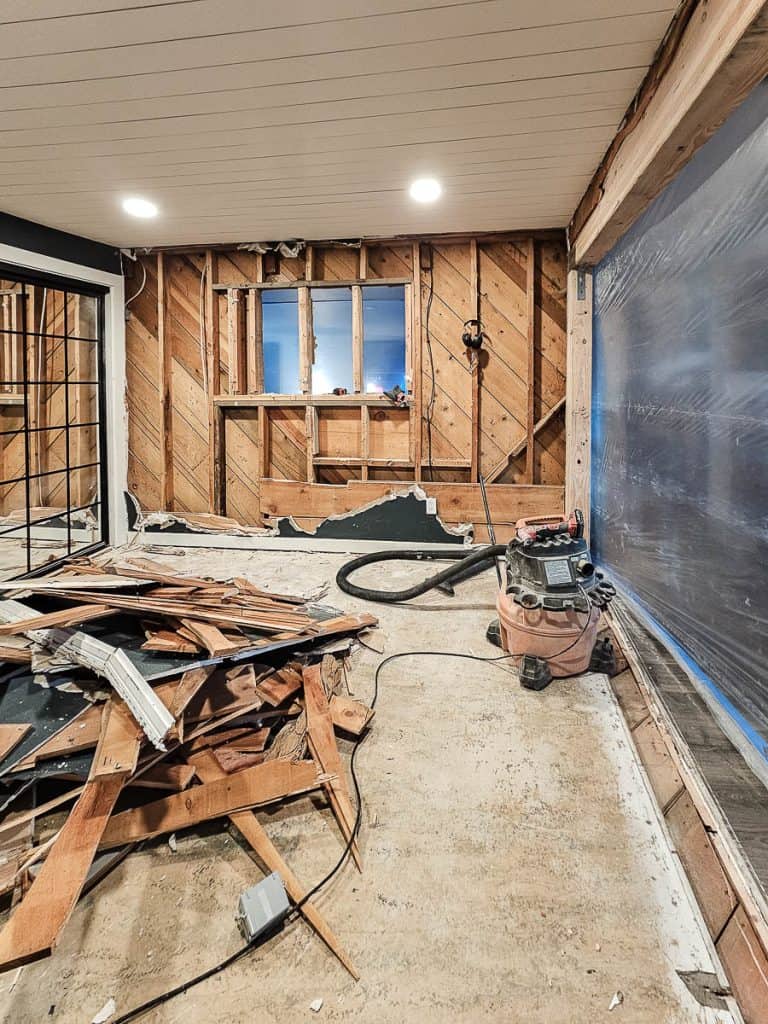 One side of wall clear and ready for demo to remove and create open concept in home