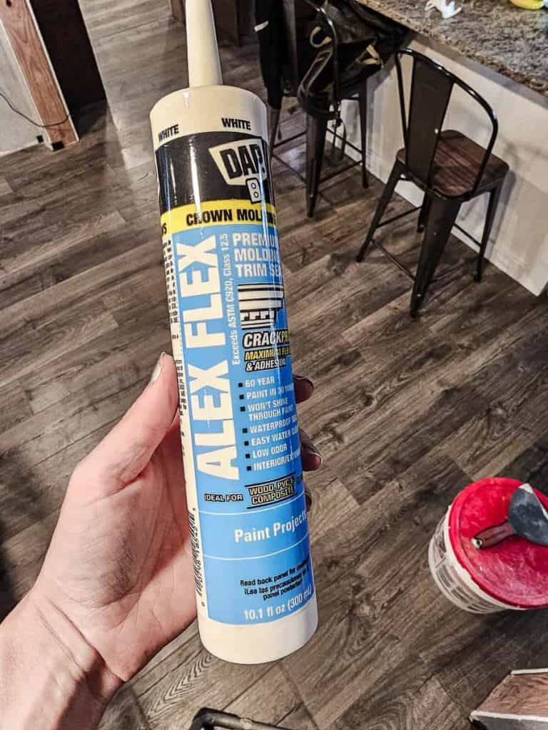 A photo featuring DAP Alex Flex caulk used on molding, windows, and door trim, highlighting its smooth finish and seamless application.