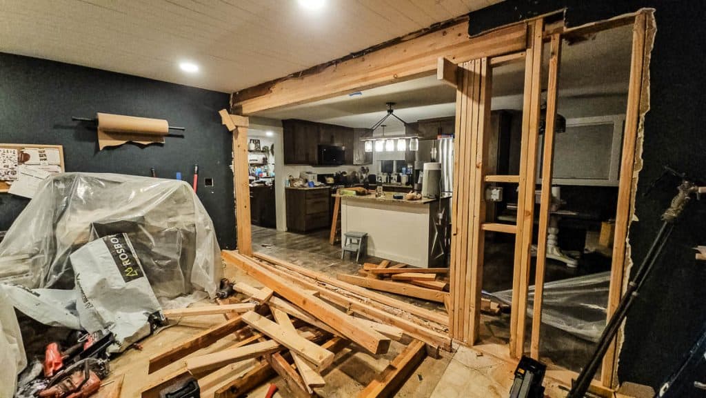 New wall opening from kitchen to future dining room with renovation mess everywhere
