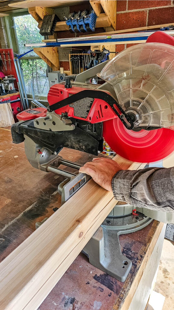 A miter saw for cutting wood to build a DIY bike rack for easy storage on your porch.