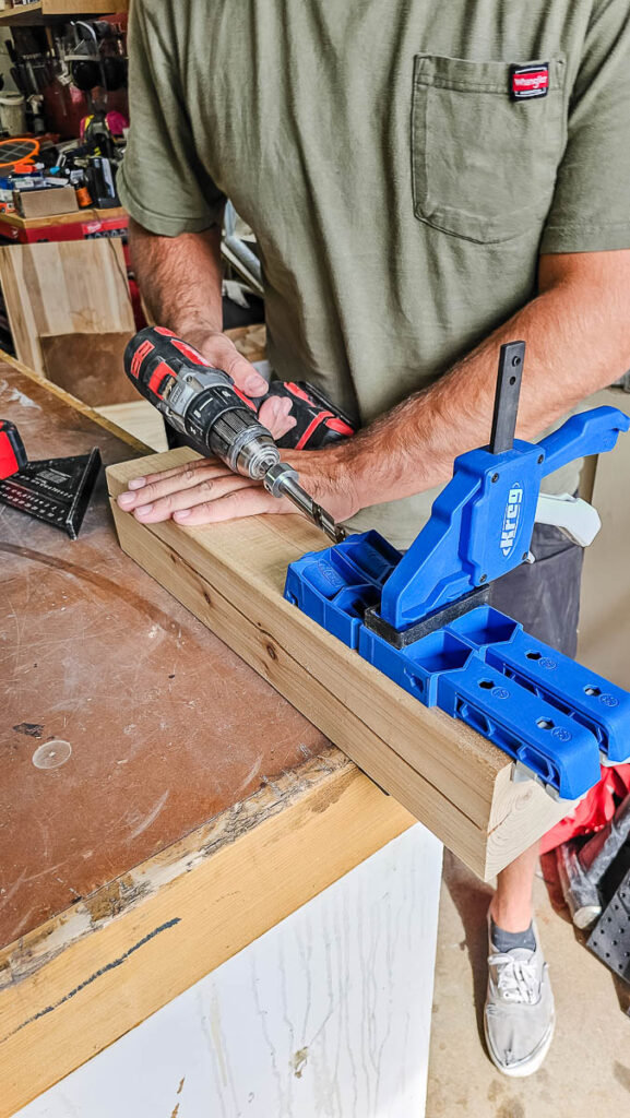 Drill pocket holes using a Kreg Pocket Hole Jig XL while building a DIY bike rack..