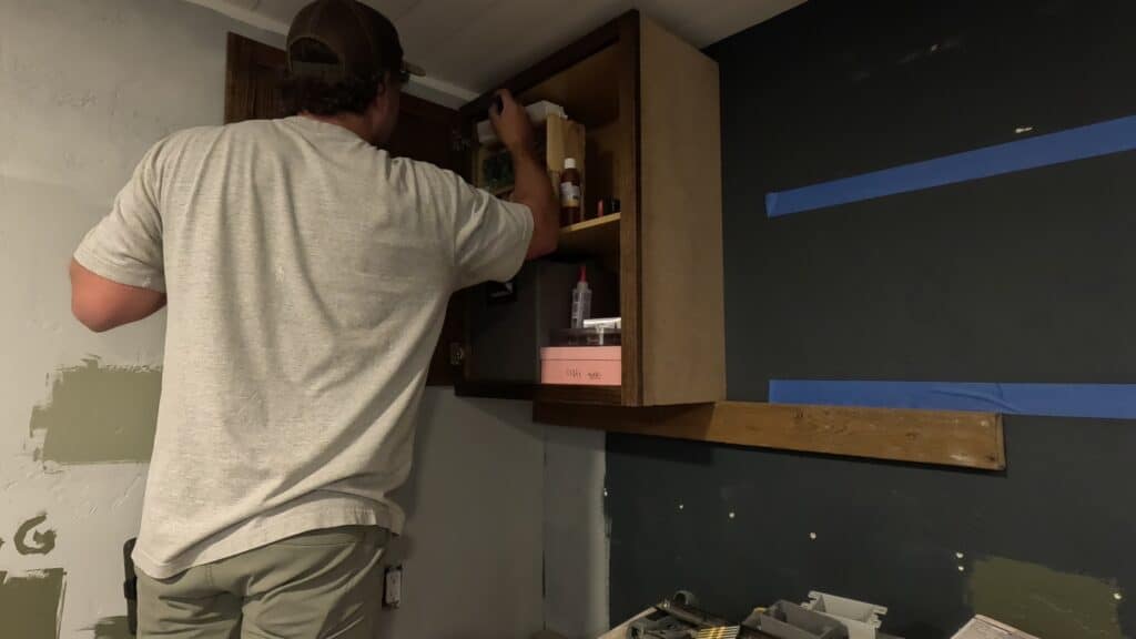 attaching cabinet doors back on to stock cabinets hanging on the wall