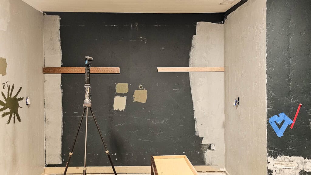 A photo of a blank wall ready to be transformed with DIY built-in cabinets for a dining room using stock cabinetry.